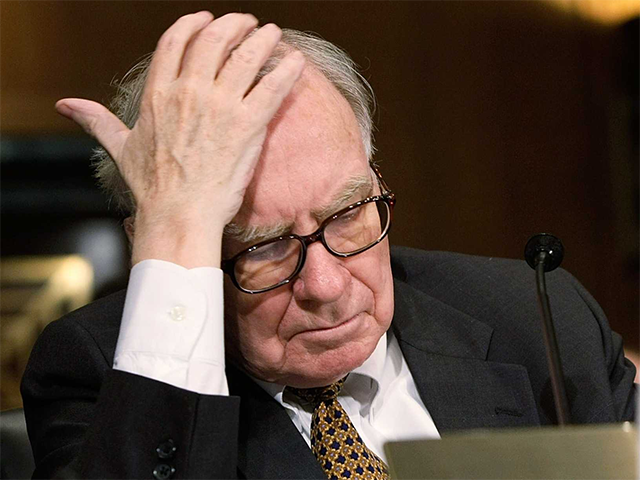 Warren Buffett holding his head
